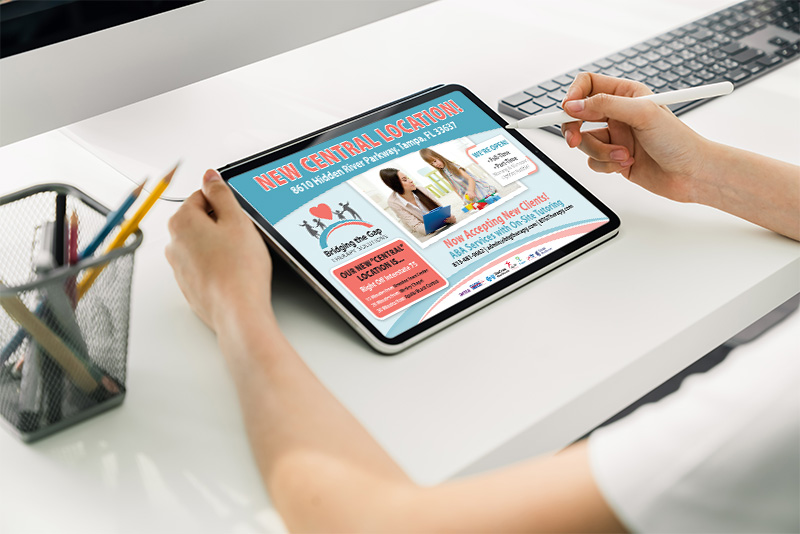 Person looking at a advertisement on a tablet while sitting at a desk . Promotional piece for Buy Digital Advertising from Well Known publications