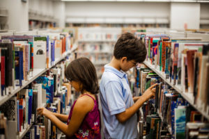 Children looking at magazines giving light to why Most readers still prefer print over Digital Advertising