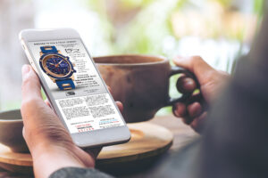 person looking at a display ad for time pieces on their phone.One of the benefits of placing display advertising for consumer products is its ability to reach a wide audience.
