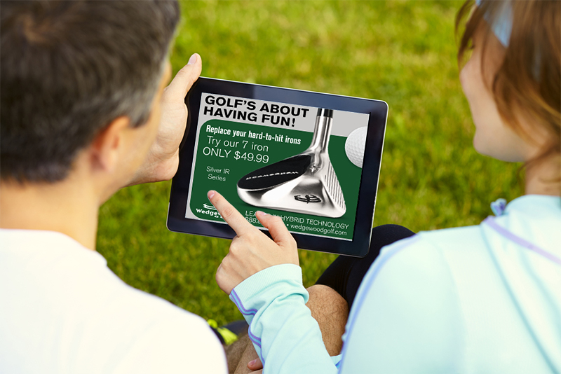 Two people looking at a digital display ad for golf clubs on a tablet. accessibility is one of the advantages of digital display advertising